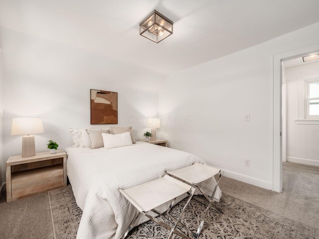 carpeted bedroom with baseboards