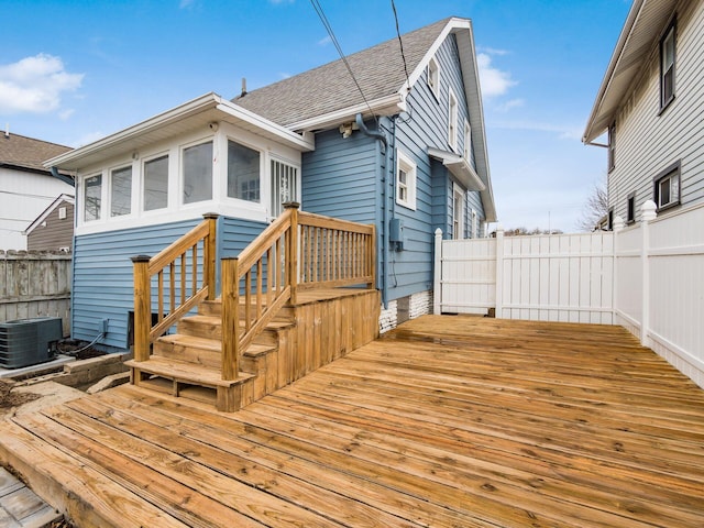 wooden deck with central AC and fence