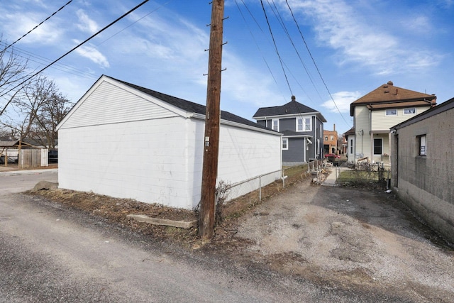 view of home's exterior featuring fence