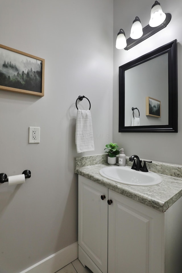 bathroom featuring vanity and baseboards