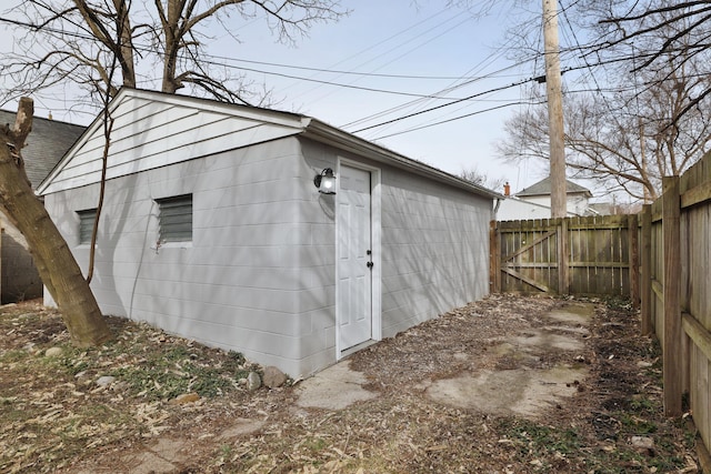 view of outdoor structure featuring an outbuilding and a fenced backyard