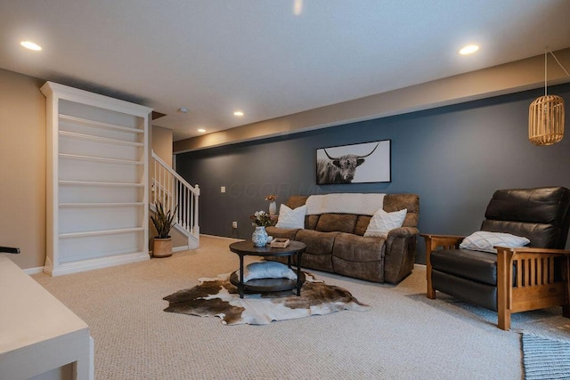 carpeted living area featuring recessed lighting, baseboards, and stairs