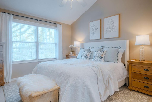 bedroom with a ceiling fan and vaulted ceiling