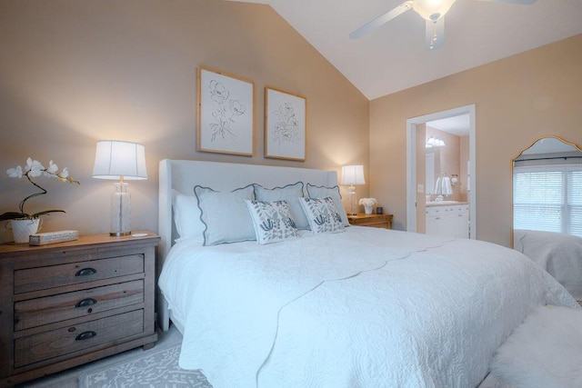 bedroom featuring lofted ceiling, a ceiling fan, and ensuite bathroom