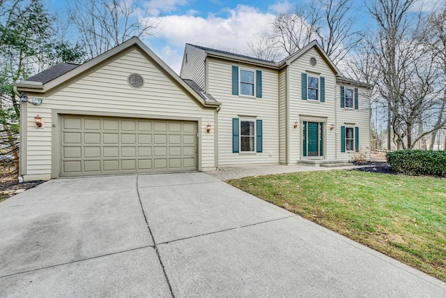 view of front of home featuring a garage, concrete driveway, and a front yard