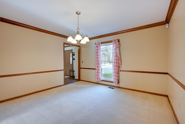 carpeted spare room with baseboards, visible vents, a notable chandelier, and ornamental molding