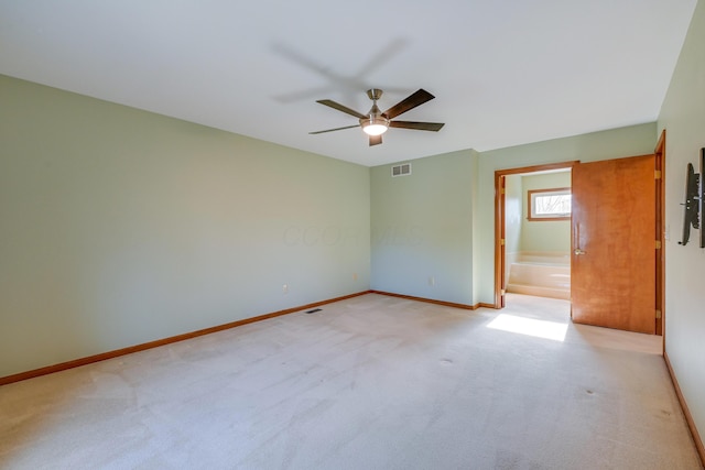 unfurnished room featuring visible vents, ceiling fan, light carpet, and baseboards