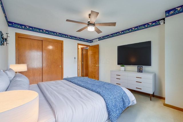 bedroom featuring a closet, visible vents, light carpet, ceiling fan, and baseboards