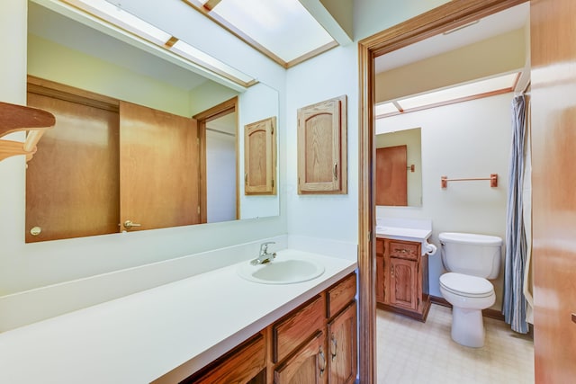 bathroom featuring vanity, toilet, and tile patterned floors