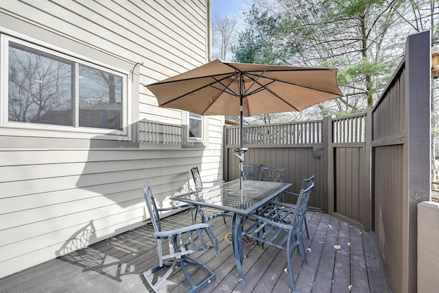 wooden deck featuring outdoor dining space