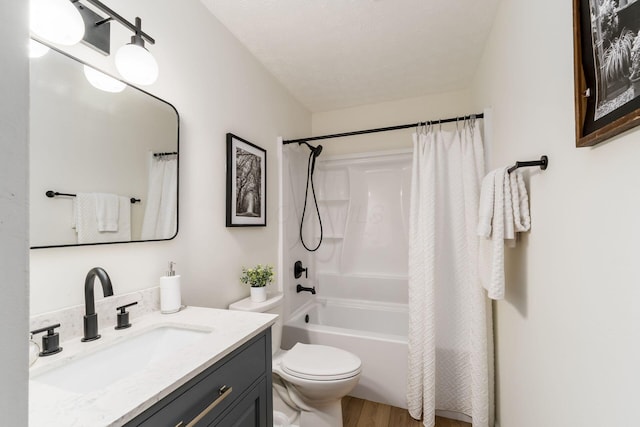 full bath featuring wood finished floors, vanity, toilet, and shower / bathtub combination with curtain