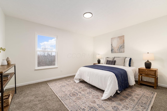 bedroom featuring carpet floors and baseboards