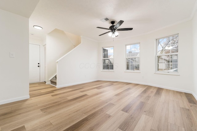 interior space with light wood-type flooring, baseboards, stairs, and visible vents