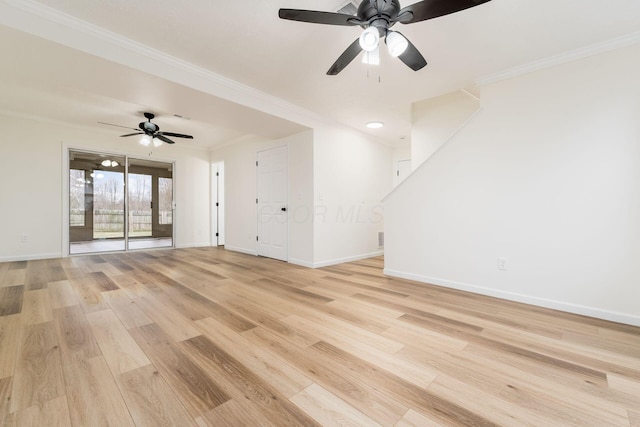 unfurnished living room featuring baseboards, ornamental molding, and light wood-style floors