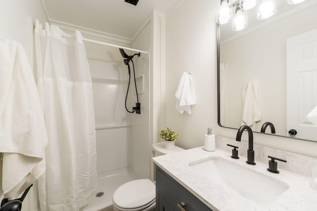 bathroom featuring toilet, ornamental molding, a stall shower, and vanity