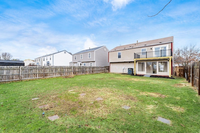 view of yard featuring a fenced backyard, a residential view, and central AC unit