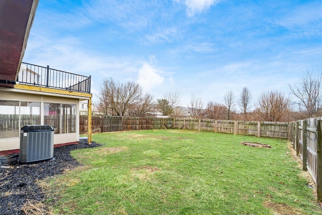 view of yard with a fenced backyard and cooling unit