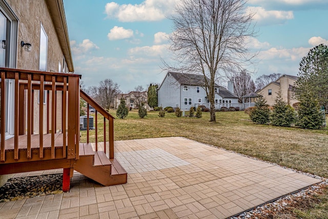 view of patio with a residential view, cooling unit, and a wooden deck