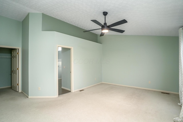 unfurnished bedroom featuring carpet, a closet, a textured ceiling, and baseboards