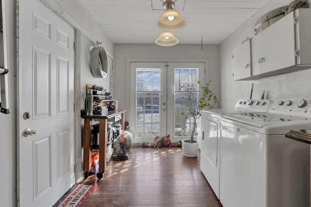 washroom with cabinet space, dark wood-style flooring, washer and dryer, and french doors