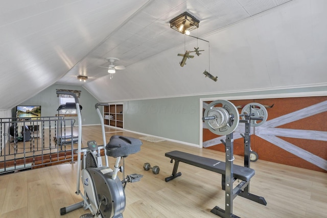 exercise area with vaulted ceiling and wood finished floors