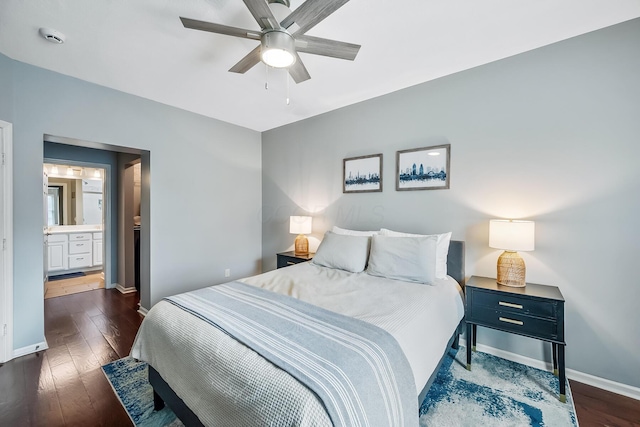 bedroom with a ceiling fan, baseboards, connected bathroom, and hardwood / wood-style floors