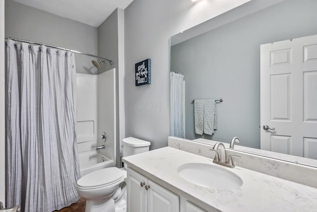 bathroom featuring toilet, shower / bath combination with curtain, and vanity