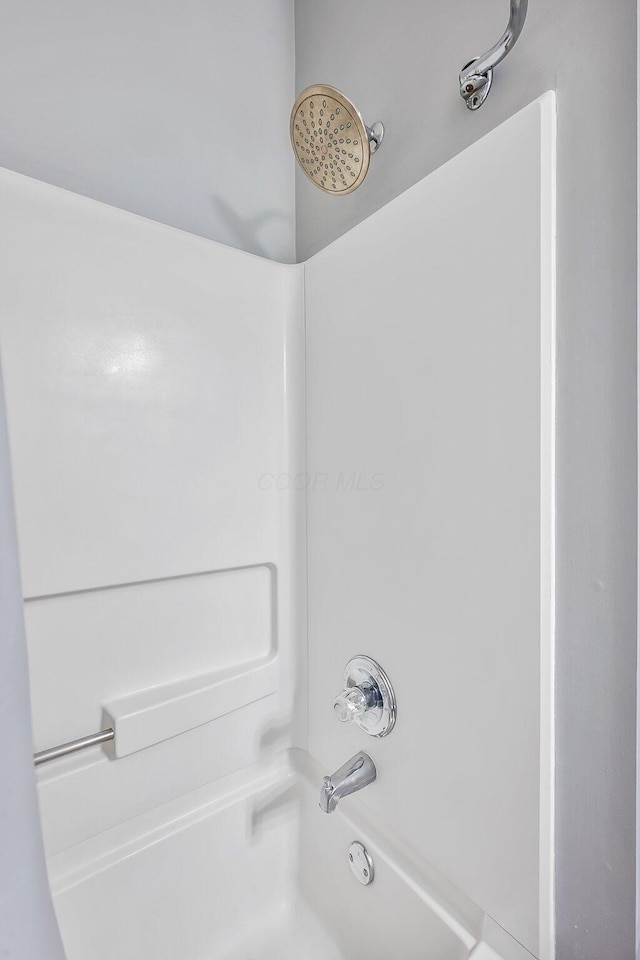 bathroom featuring washtub / shower combination