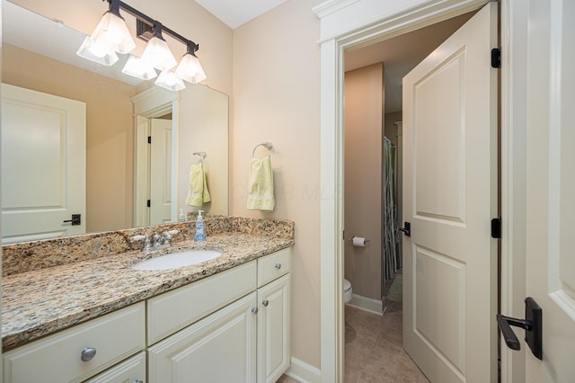 full bathroom with curtained shower, toilet, vanity, tile patterned flooring, and baseboards