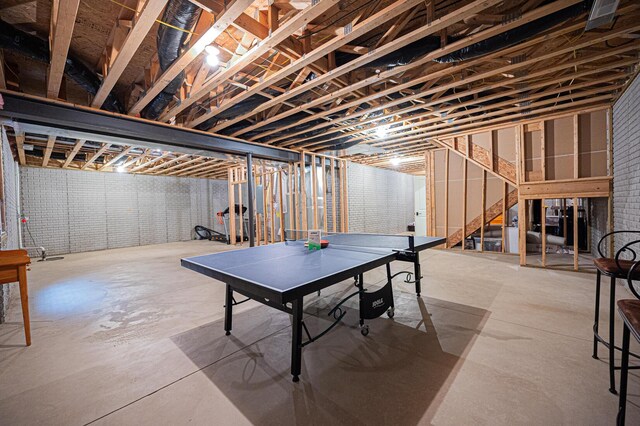 rec room with concrete floors