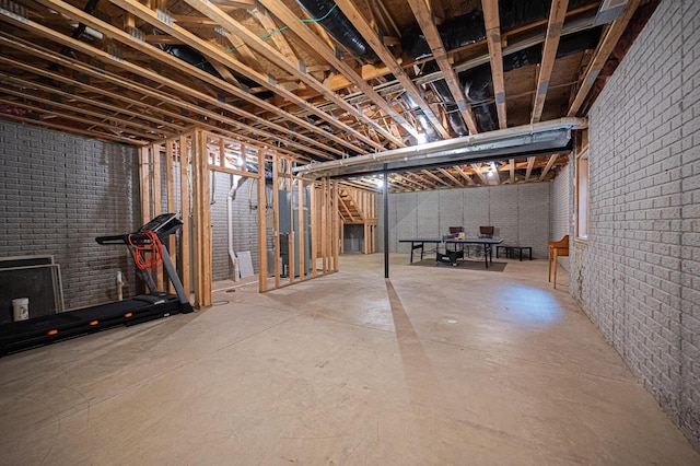 unfinished basement with brick wall