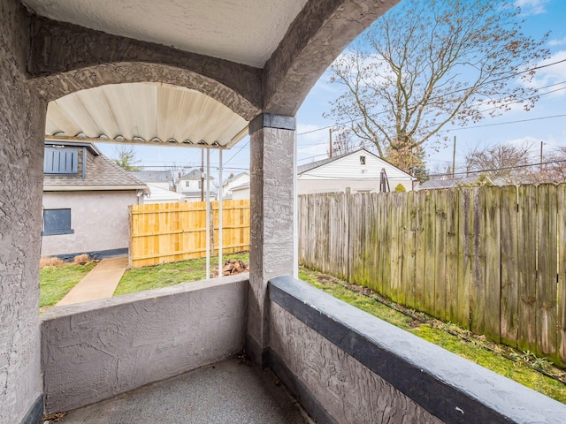 view of patio featuring fence