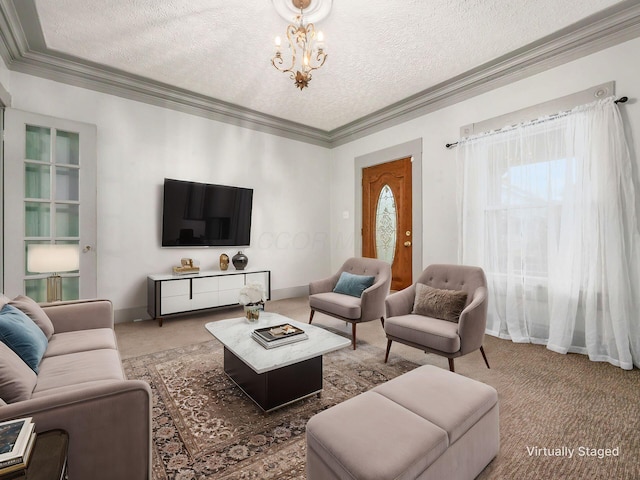 living room featuring an inviting chandelier, carpet, a textured ceiling, and crown molding