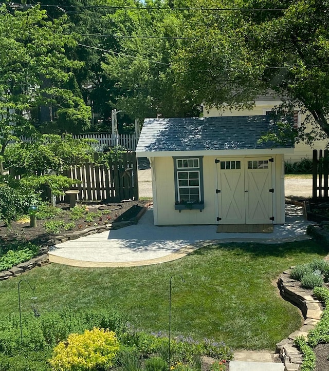 view of shed with fence