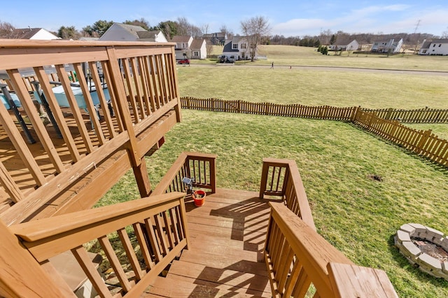 exterior space with a residential view, a fenced backyard, and a wooden deck