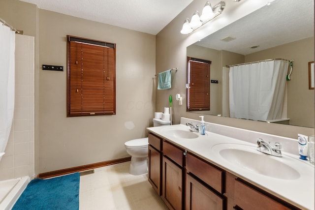 full bath featuring curtained shower, baseboards, and a sink