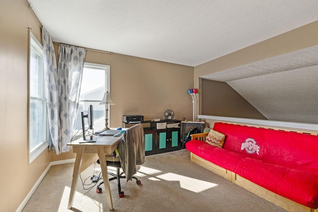 office featuring a textured ceiling, baseboards, carpet flooring, and lofted ceiling