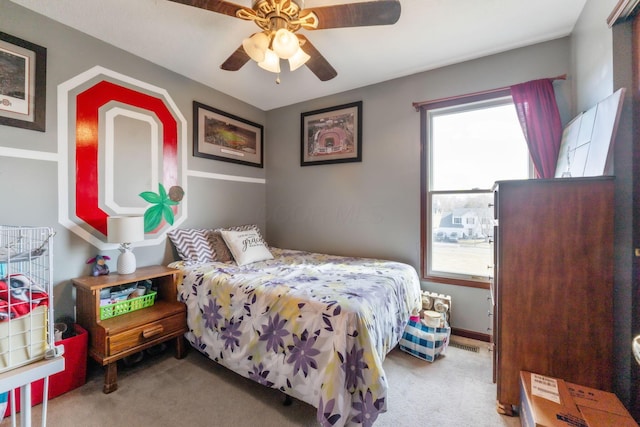 carpeted bedroom featuring ceiling fan