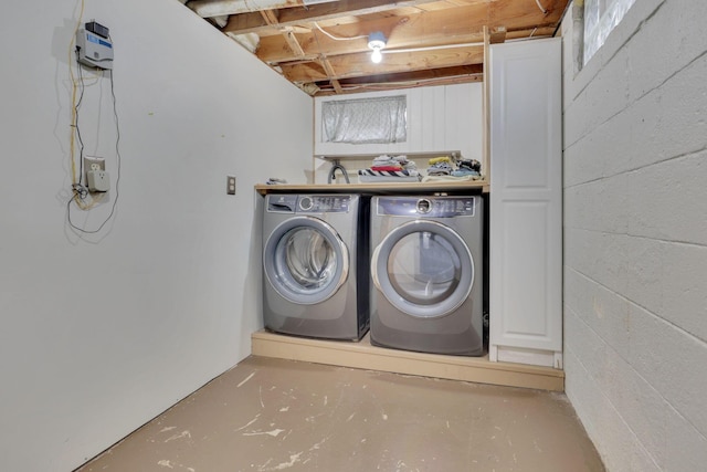 washroom featuring laundry area and washer and clothes dryer