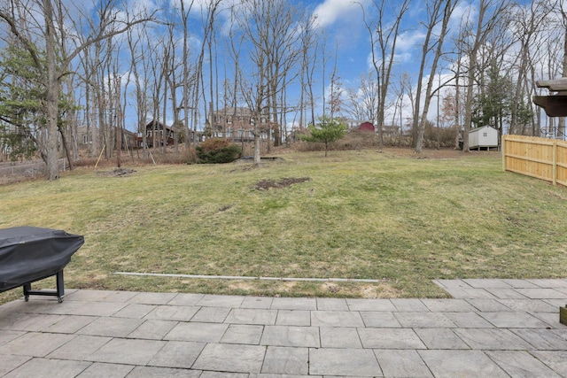 view of yard with fence and a patio