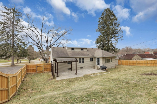 rear view of house with a patio, a lawn, entry steps, crawl space, and a fenced backyard