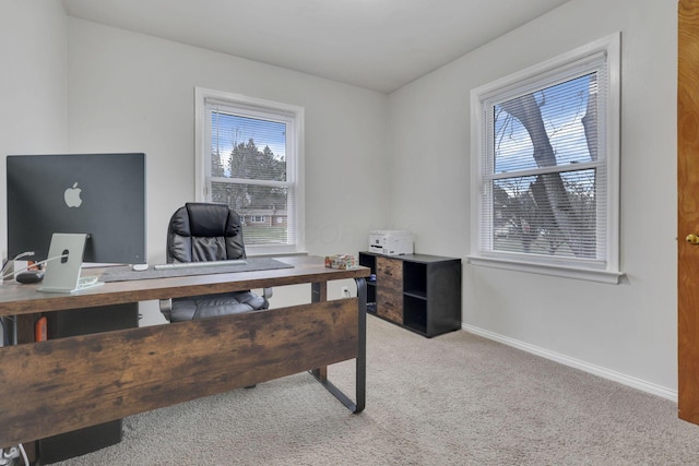 office with light colored carpet and baseboards