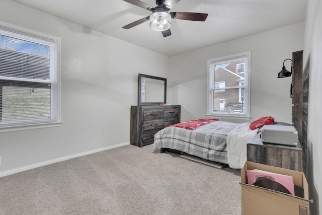 bedroom featuring ceiling fan, carpet floors, and baseboards