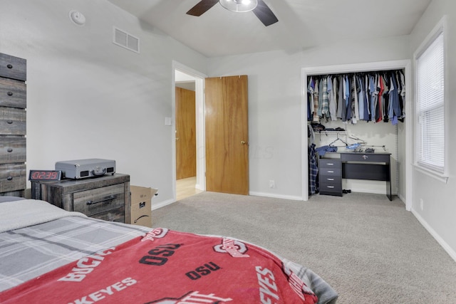 bedroom with carpet floors, visible vents, and baseboards