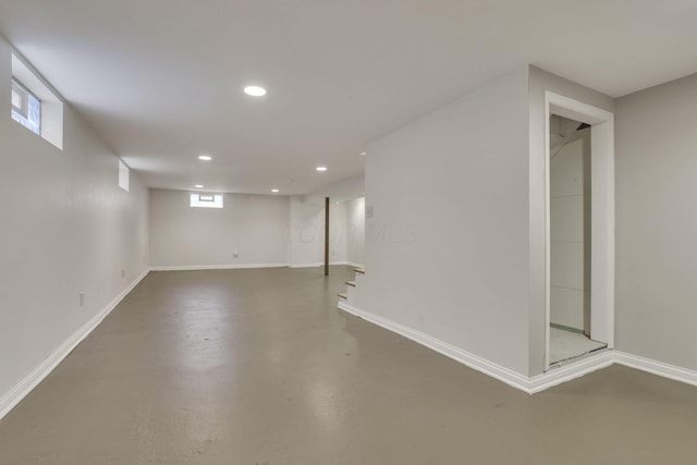 basement featuring baseboards and recessed lighting