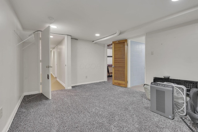 finished basement featuring recessed lighting, carpet, and baseboards