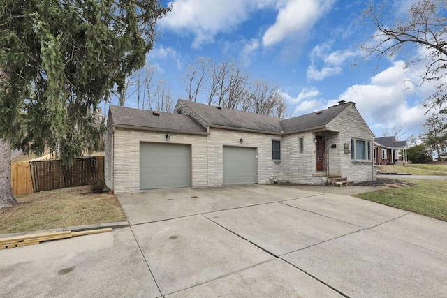 single story home with an attached garage, fence, stone siding, concrete driveway, and roof with shingles