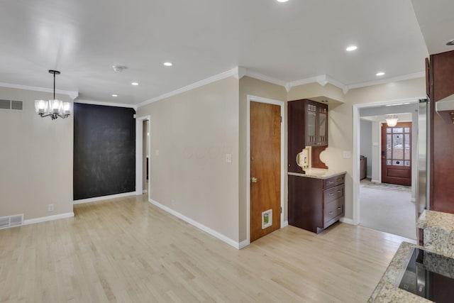 interior space with light wood finished floors, baseboards, visible vents, and recessed lighting