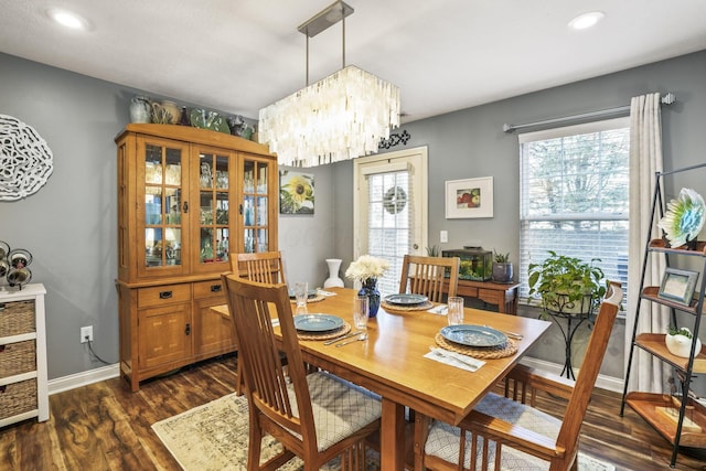 dining room featuring baseboards, dark wood-type flooring, and recessed lighting