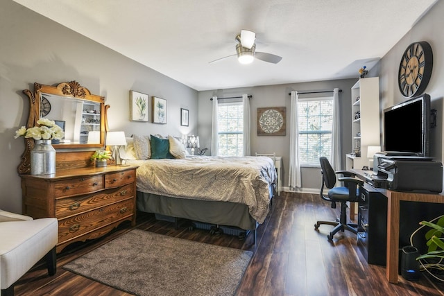 bedroom with a ceiling fan, wood-type flooring, and baseboards